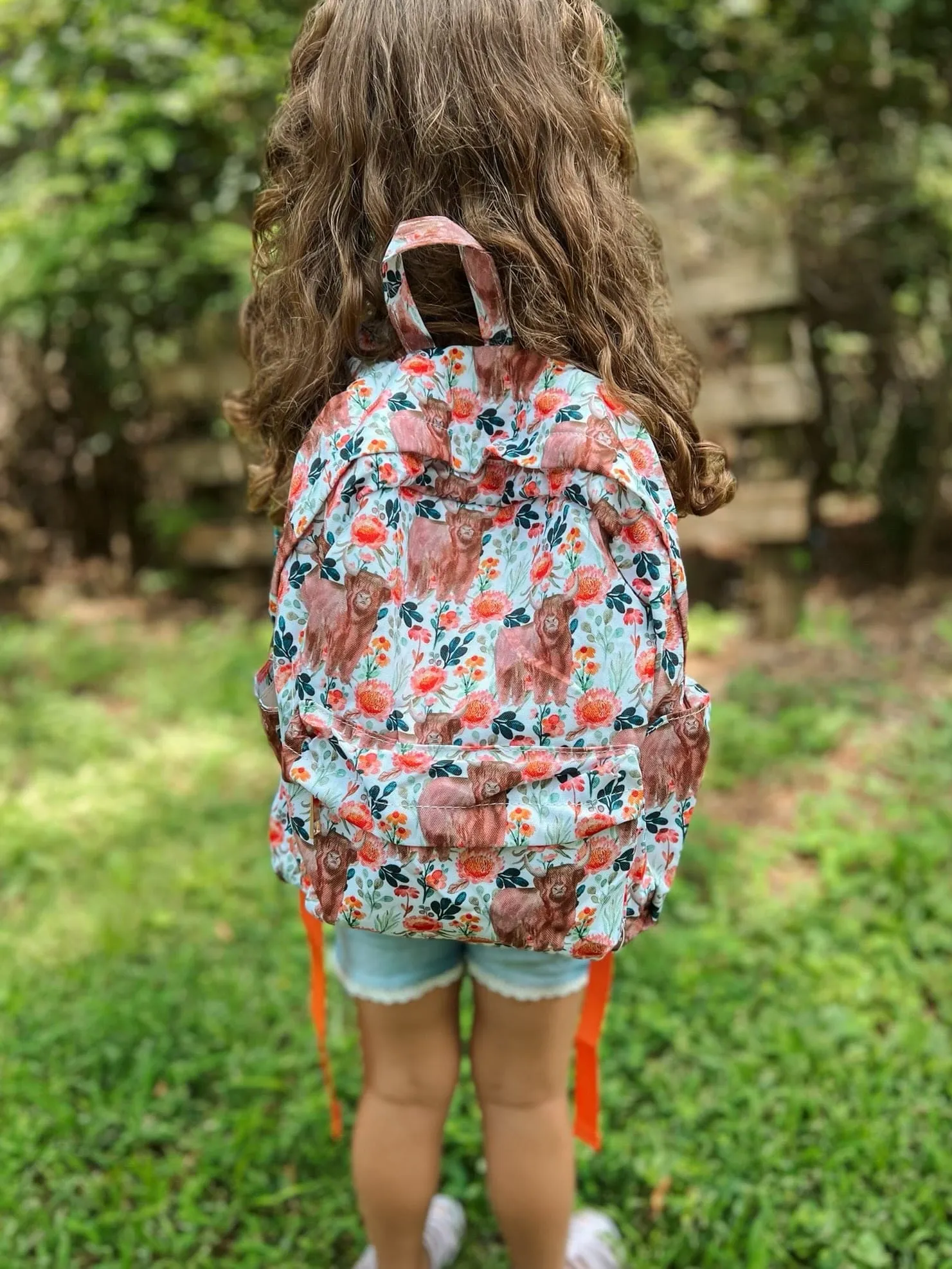 Orange Flowers Highland Cow Backpack